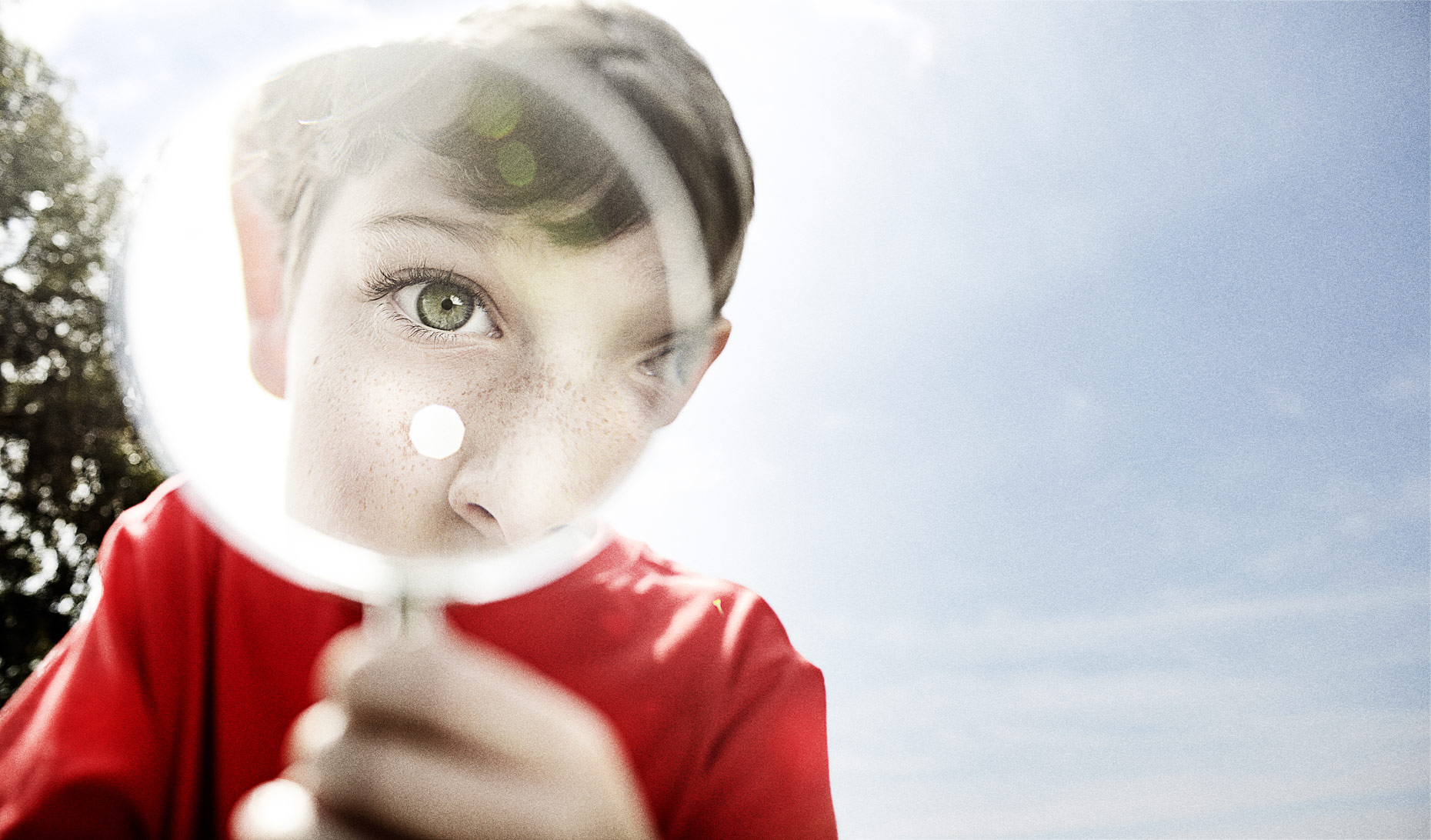 Boy with Magnifying glass