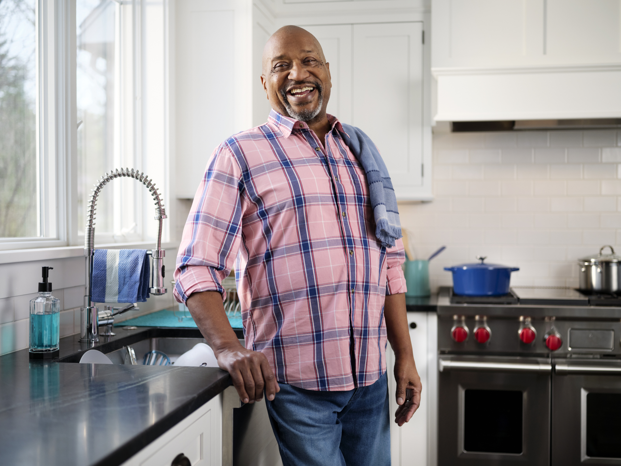 Happy black male in kitchen