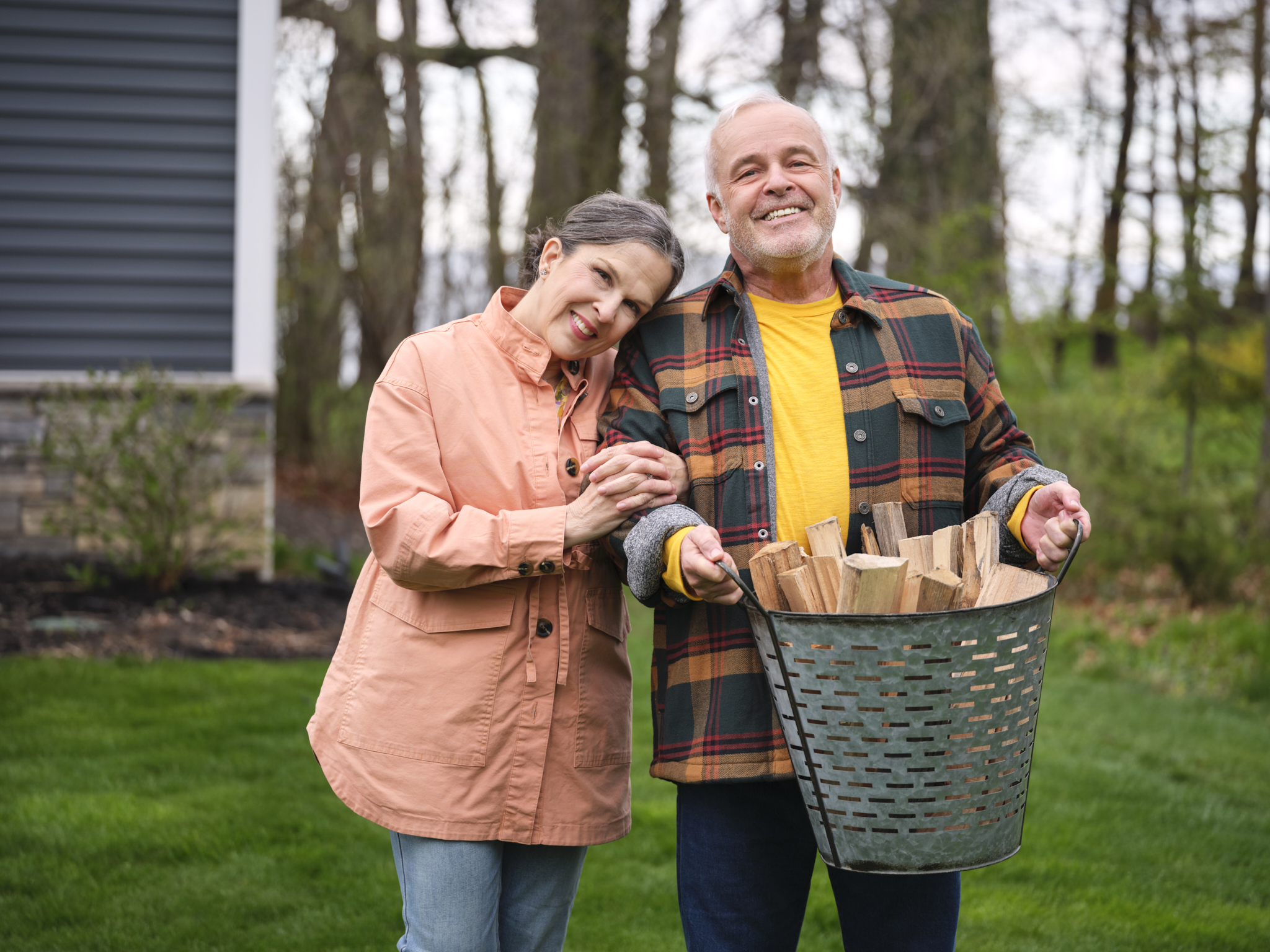 Senior couple gathering firewood